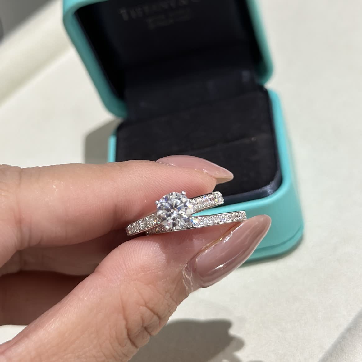 Tiffany & Co. Solitaire Ring with Diamond Band